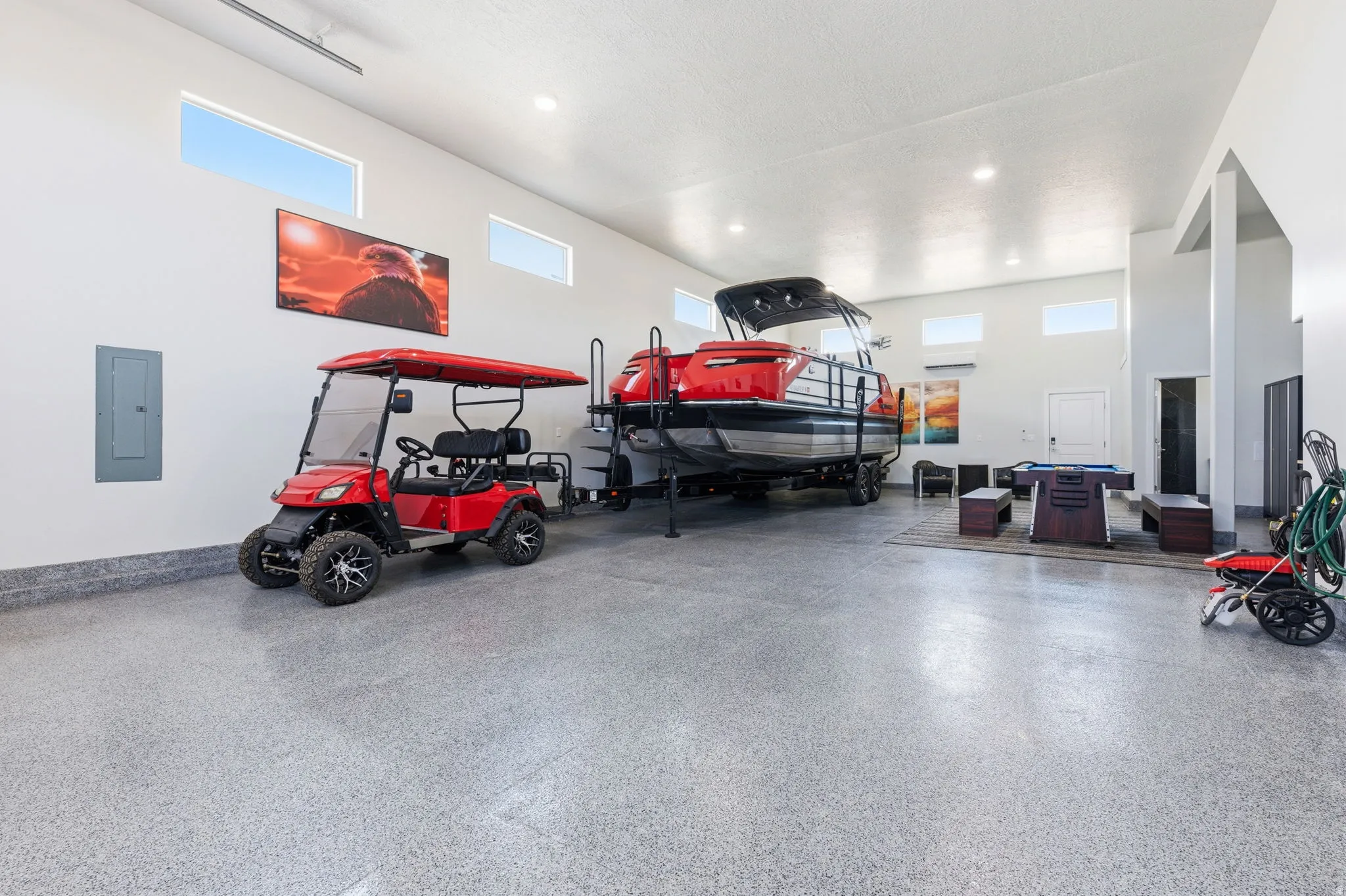 Garage with electric panel and recessed lighting