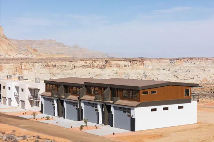 View of front of house with a mountain view, view of desert, and driveway