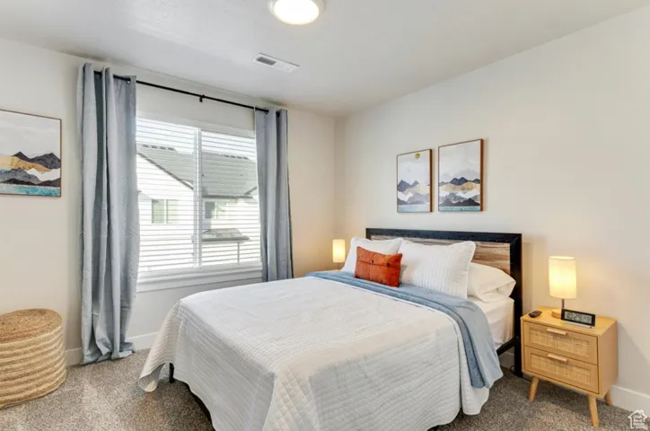 Carpeted bedroom with baseboards