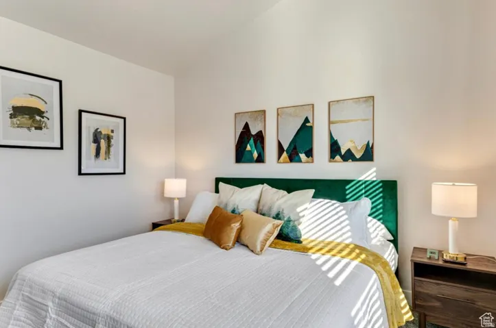 Bedroom featuring lofted ceiling