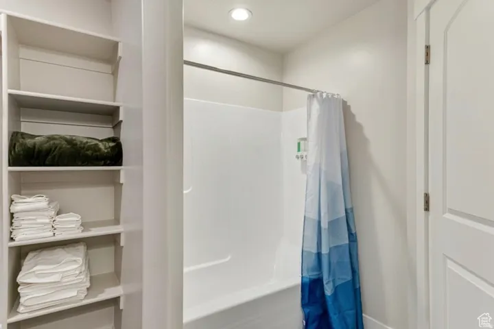 Full bathroom with recessed lighting and shower / tub combo