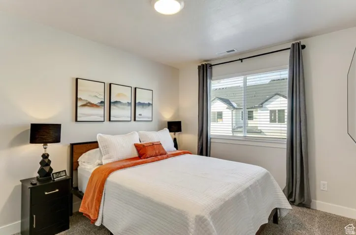 Bedroom with carpet flooring