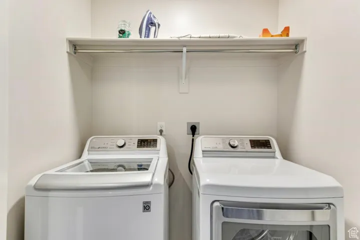 Laundry area featuring independent washer and dryer
