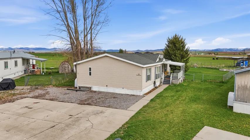 View of side of property featuring a view of rural / pastoral area and a mountain view
