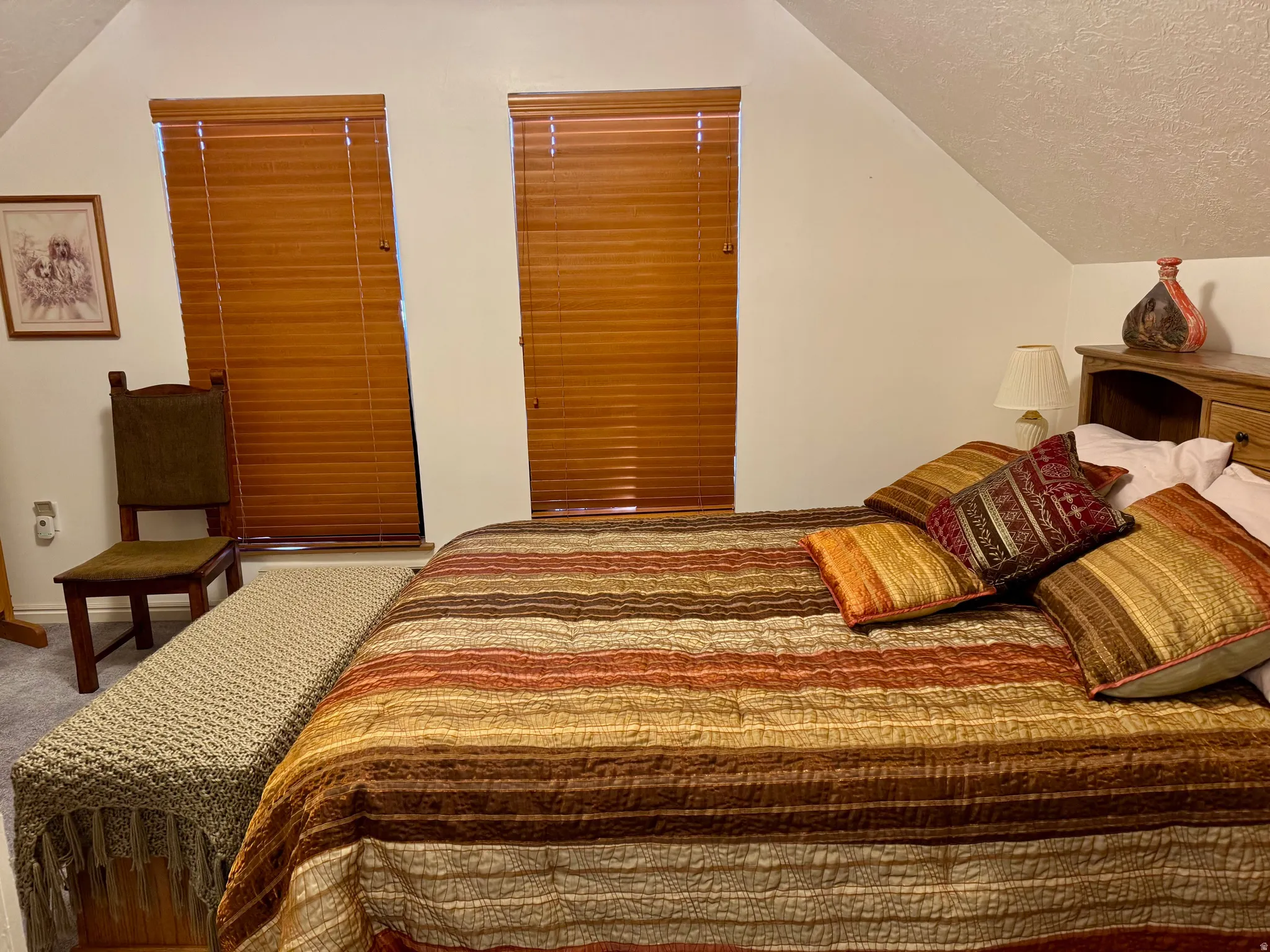 Carpeted bedroom featuring baseboards