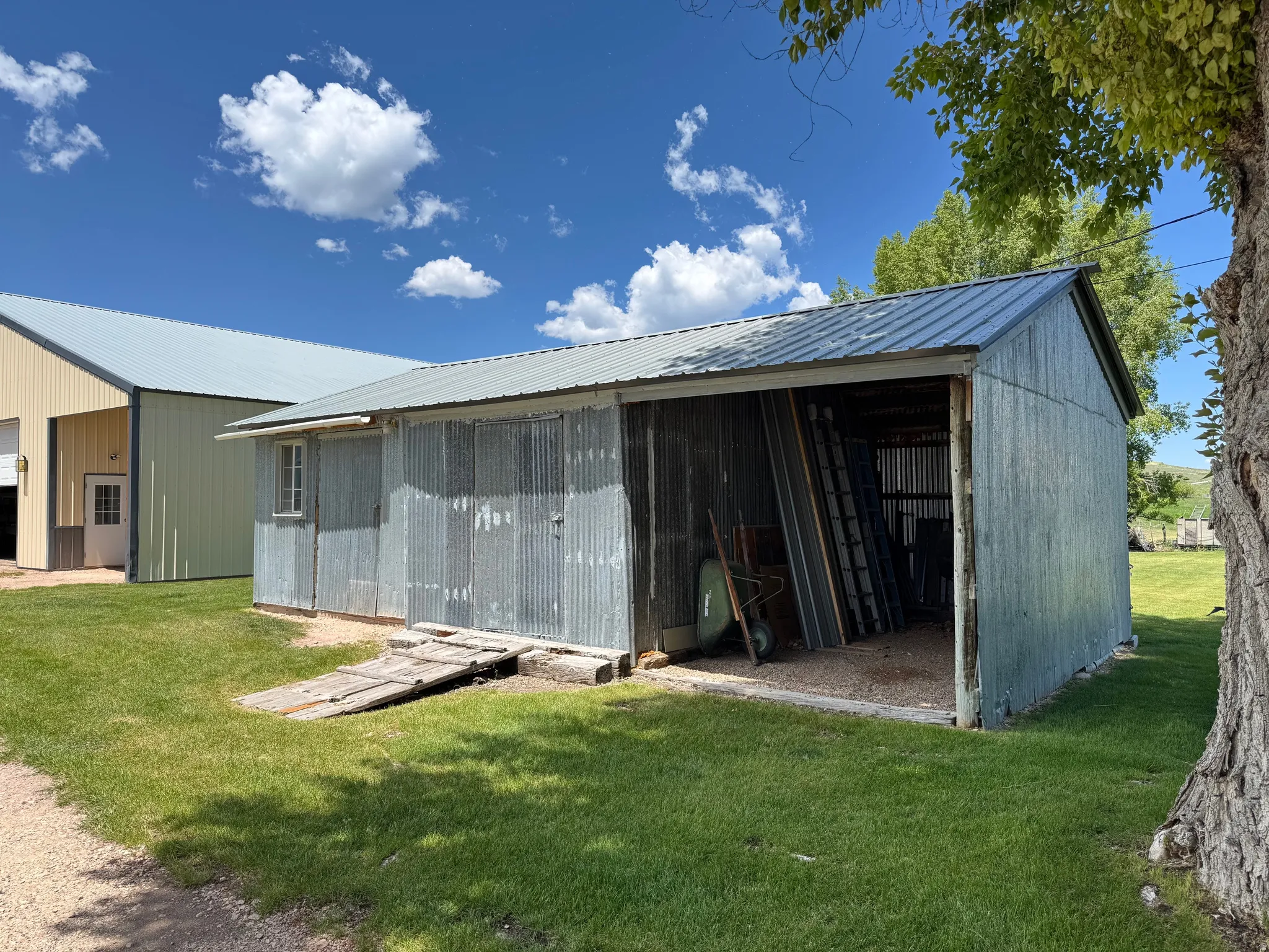 View of pole building featuring a yard