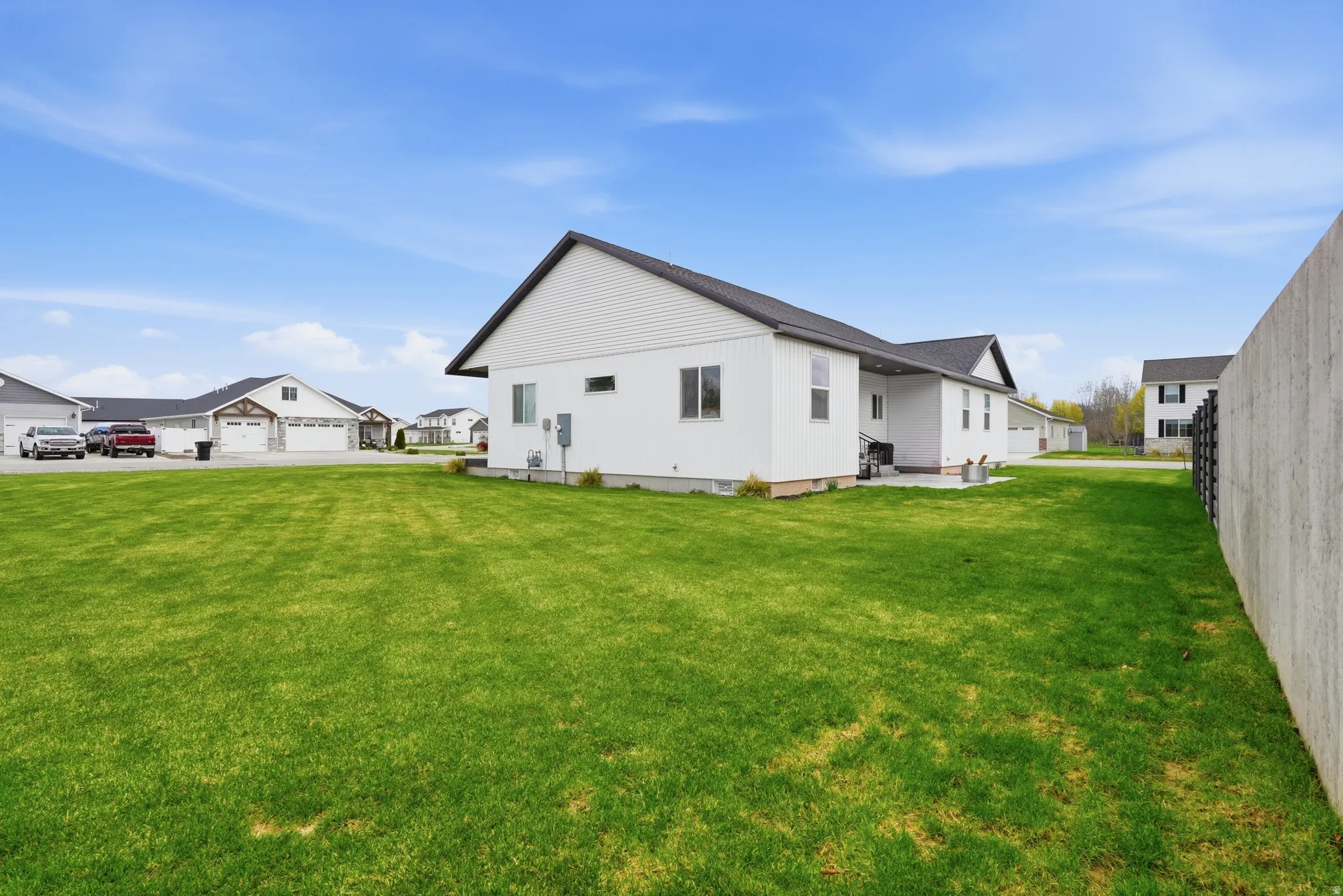 Back of house featuring a patio area and a residential view