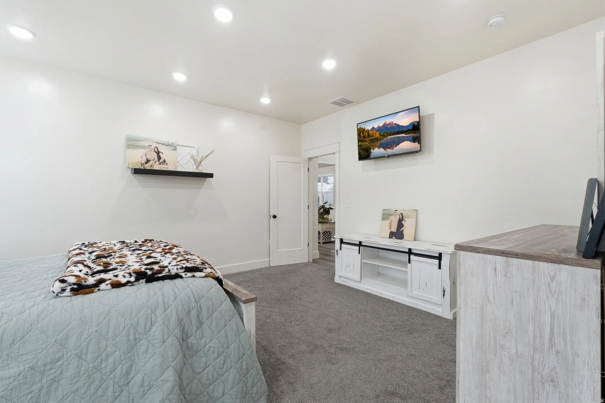 Bedroom featuring light carpet and recessed lighting