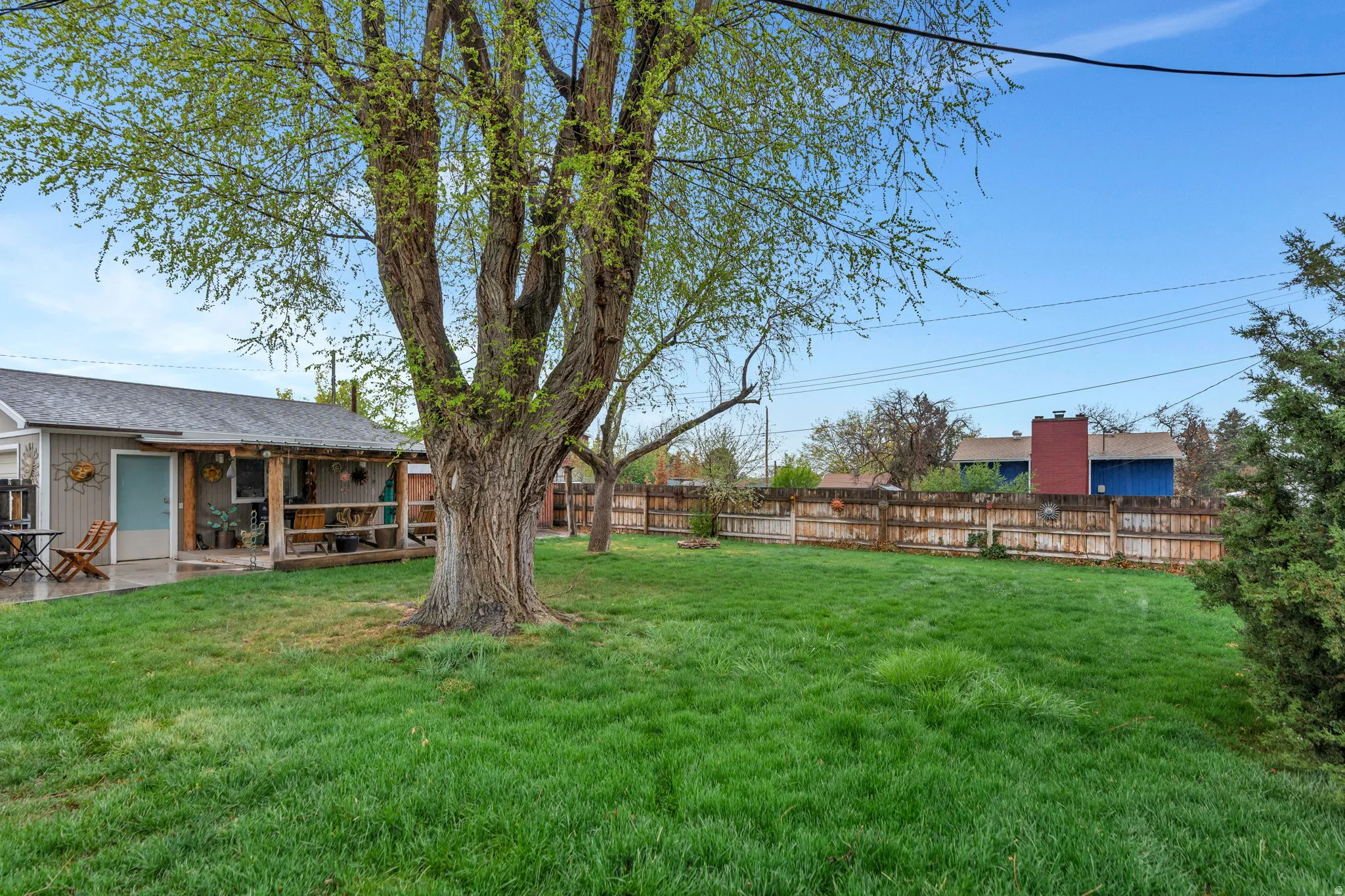 Fenced backyard with a patio
