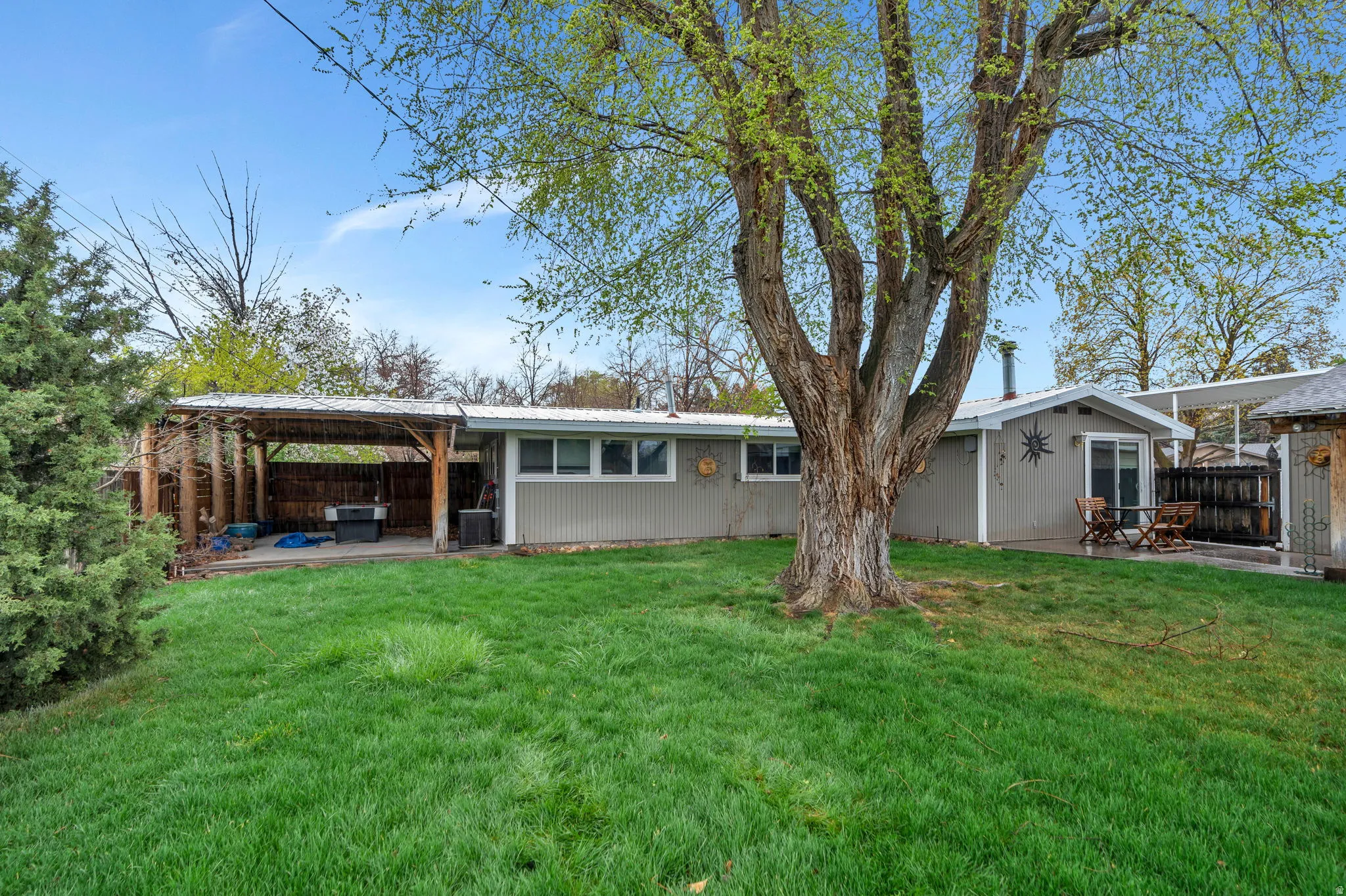 Back of house with a patio, a fenced backyard, and a gazebo