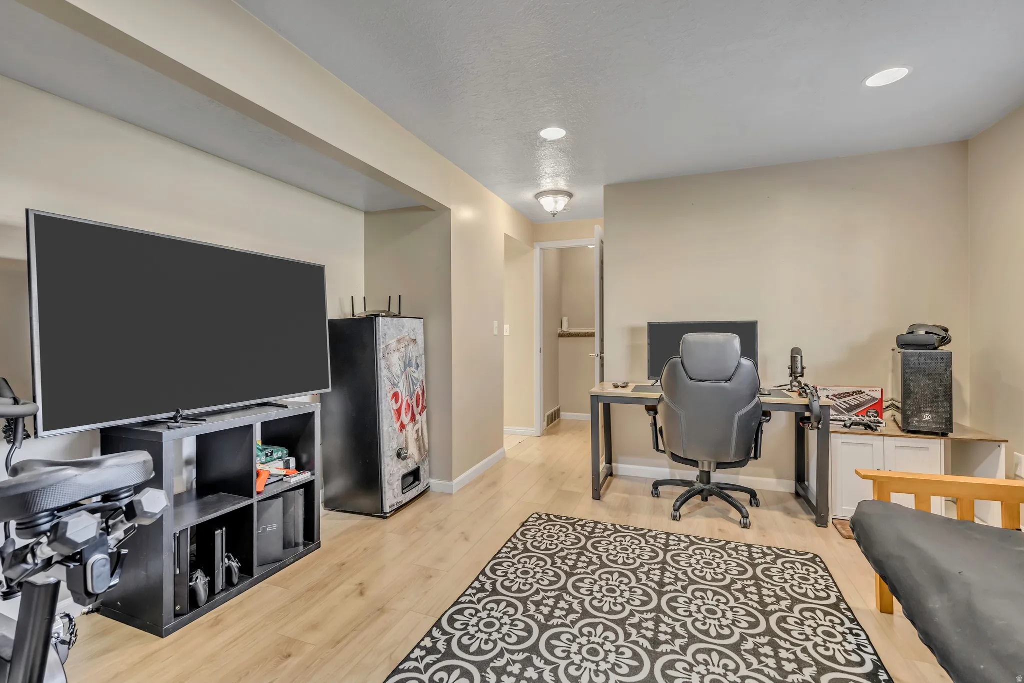 Office featuring light wood-type flooring and recessed lighting
