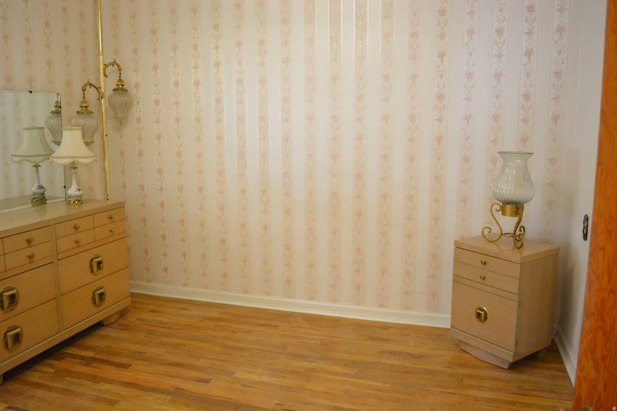 Bedroom featuring light wood-type flooring and baseboards