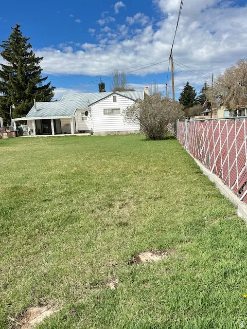 View of yard with a patio