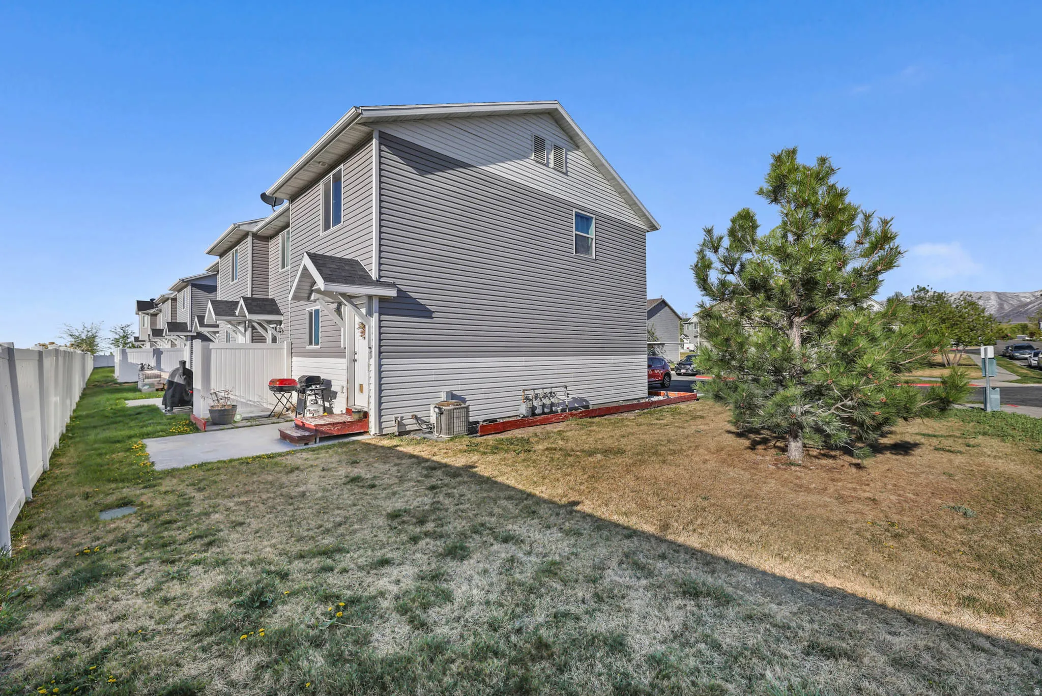 View of property exterior with a central AC unit