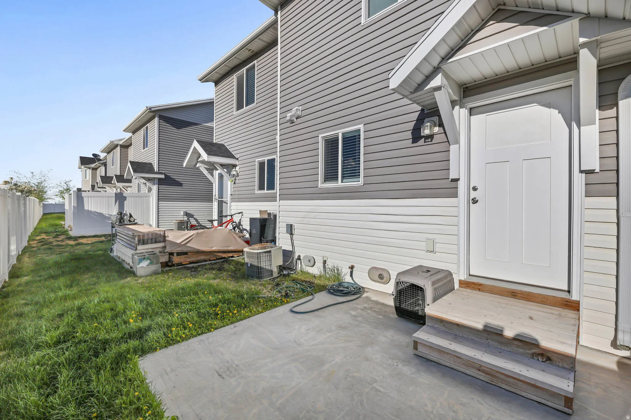 Rear view of property featuring a wooden deck