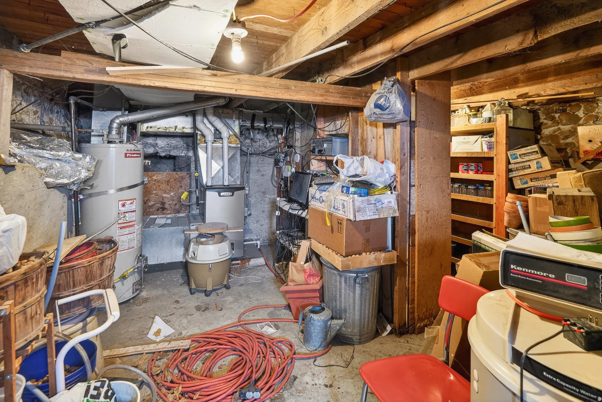 Unfinished basement with strapped water heater