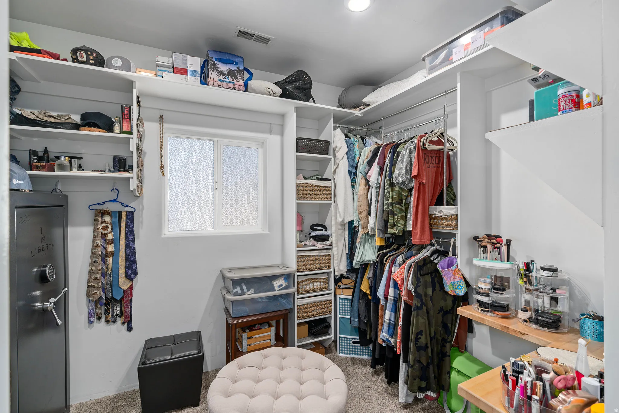 Walk in closet with carpet