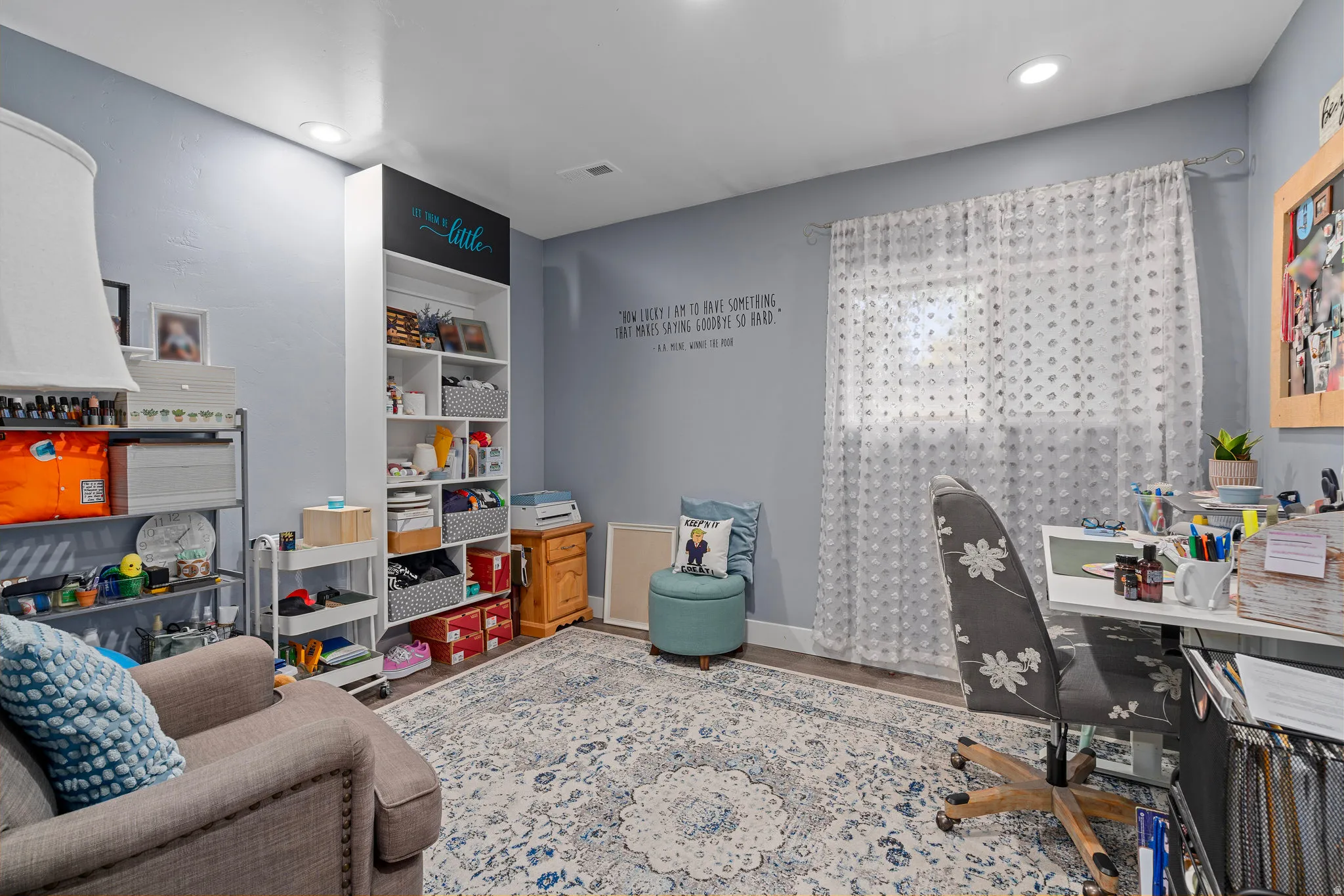 Office area with wood finished floors and recessed lighting