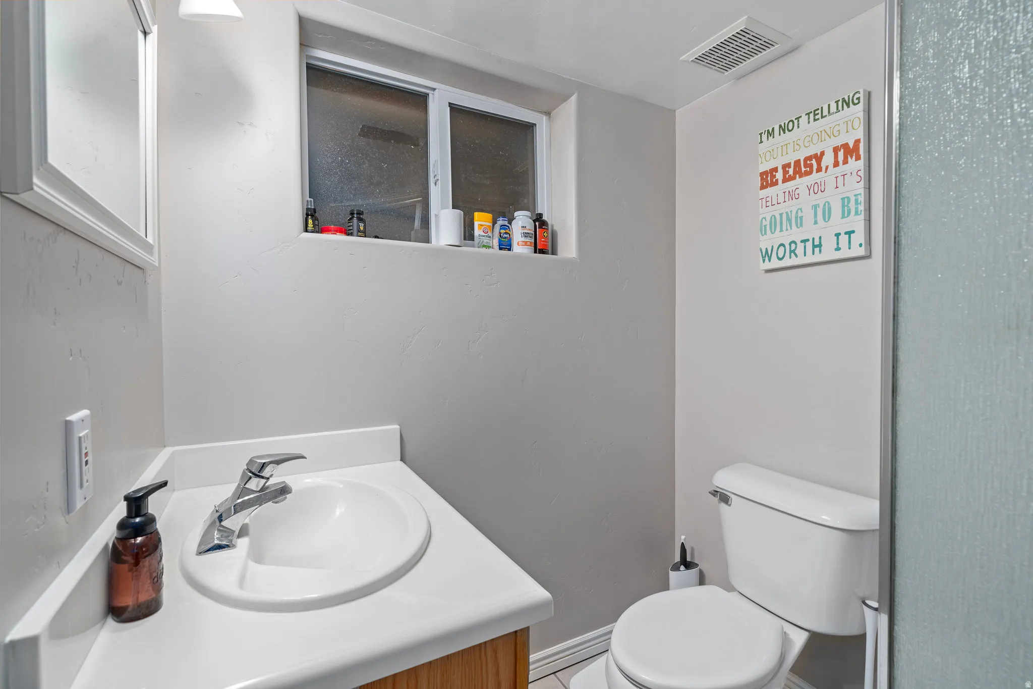 Bathroom with vanity and toilet