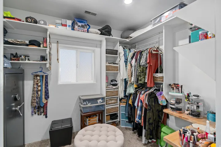 Walk in closet with carpet