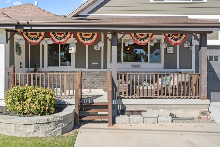 Doorway to property featuring a porch
