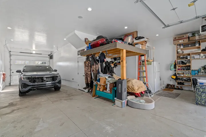 Garage with a heating unit and recessed lighting