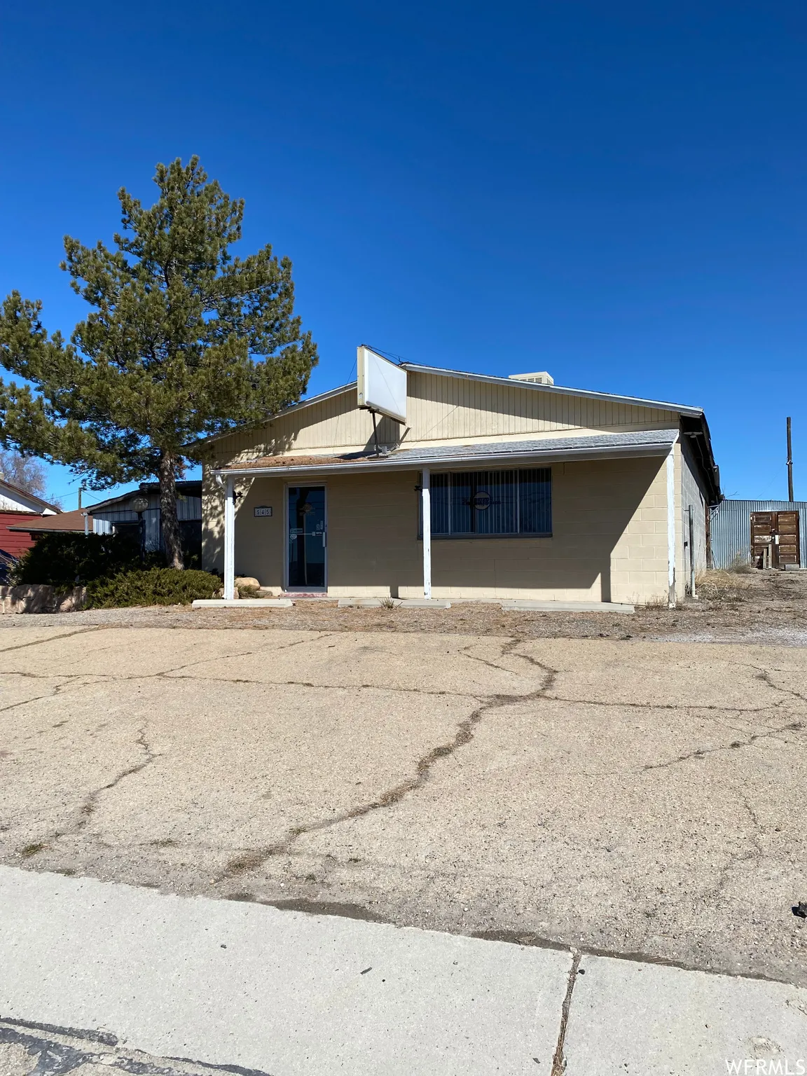 View of front of home with concrete block siding