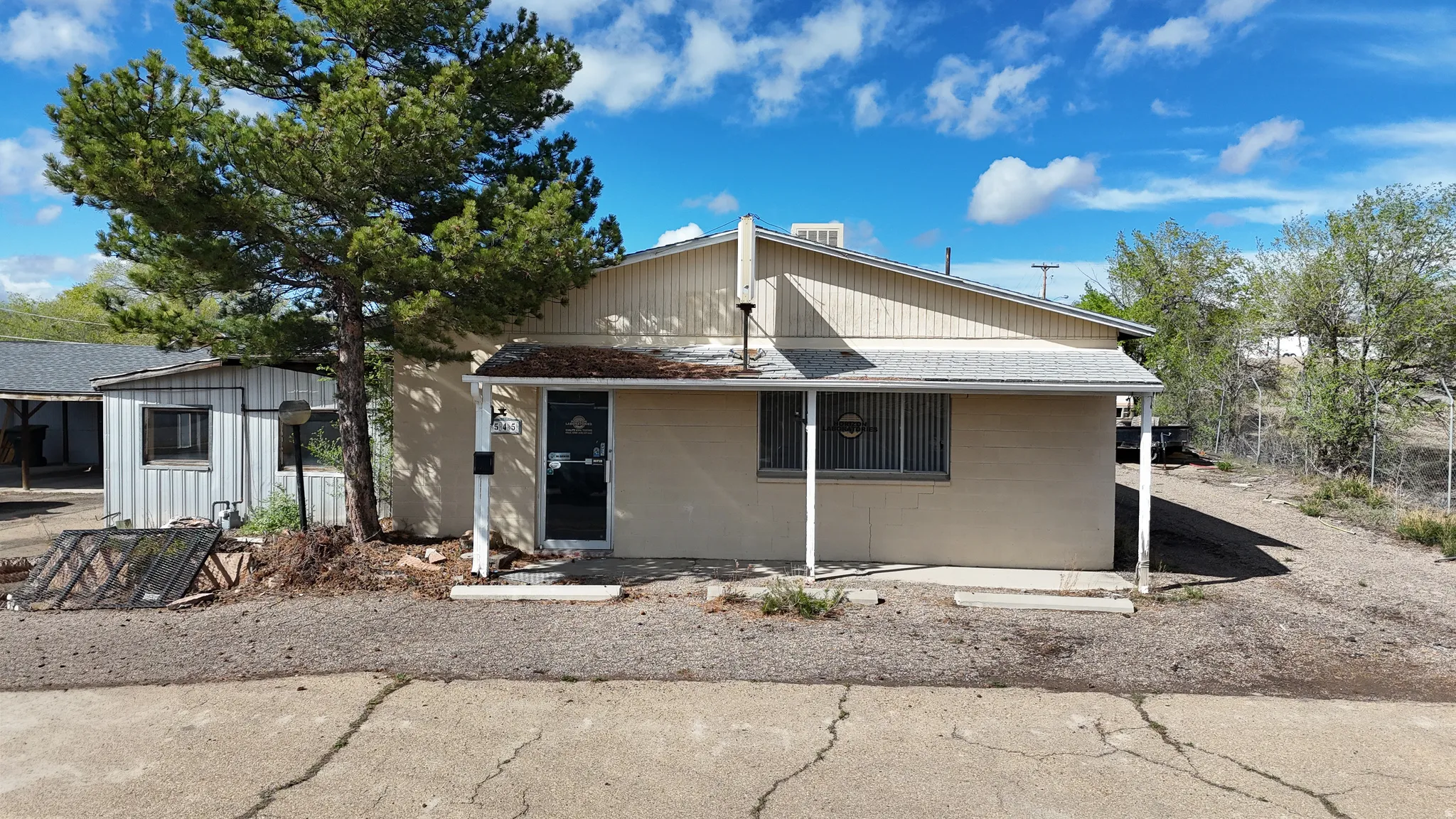 View of front of property featuring concrete block siding