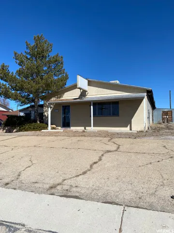View of front of home with concrete block siding
