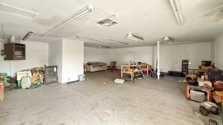 Garage featuring a heating unit