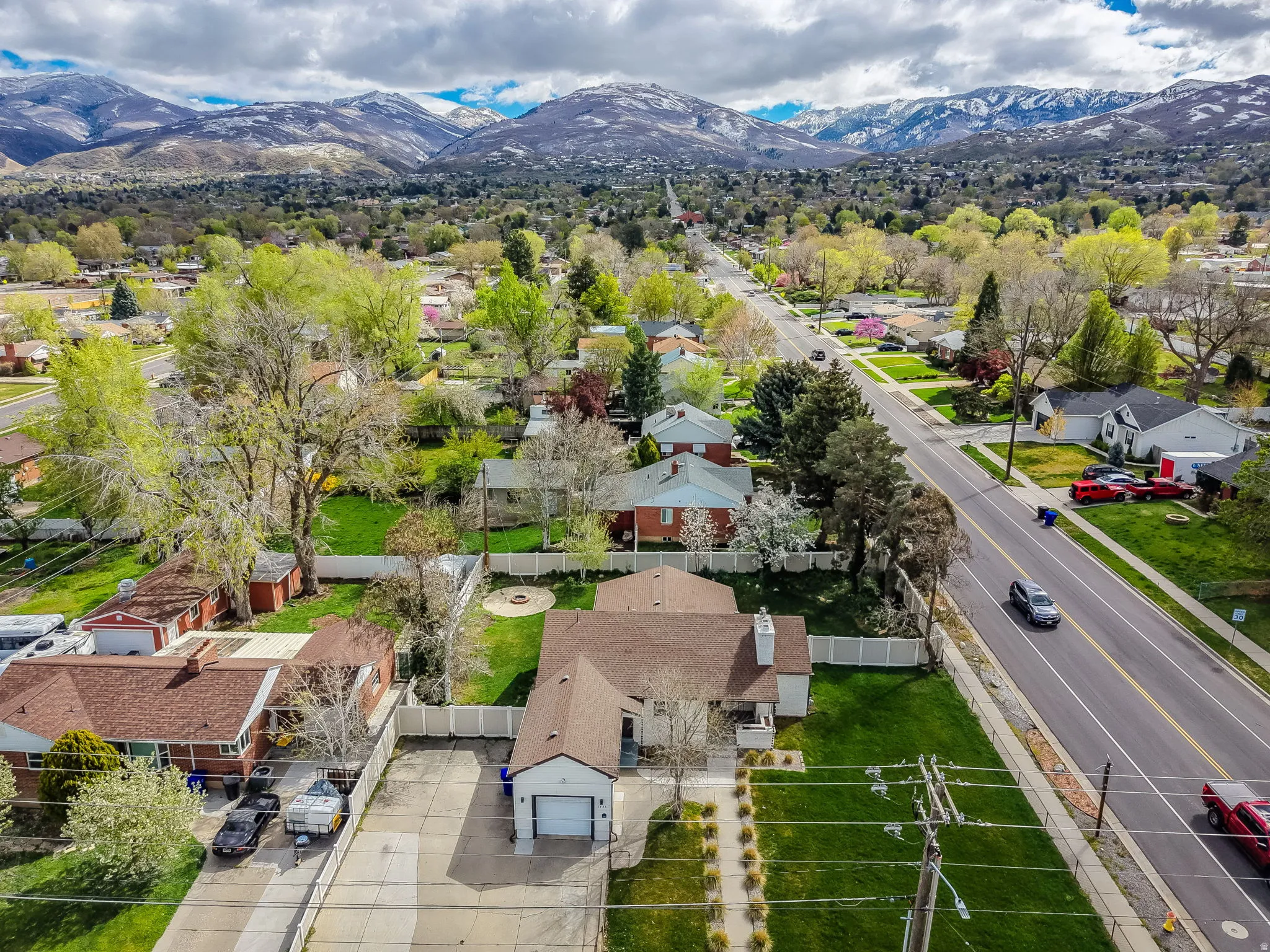 Aerial view of residential area featuring a mountain backdrop