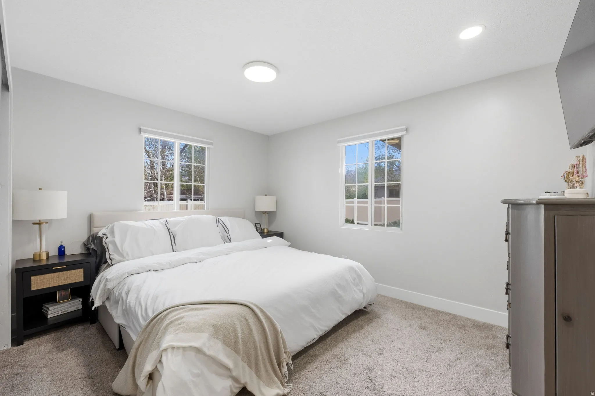Bedroom featuring light colored carpet and recessed lighting