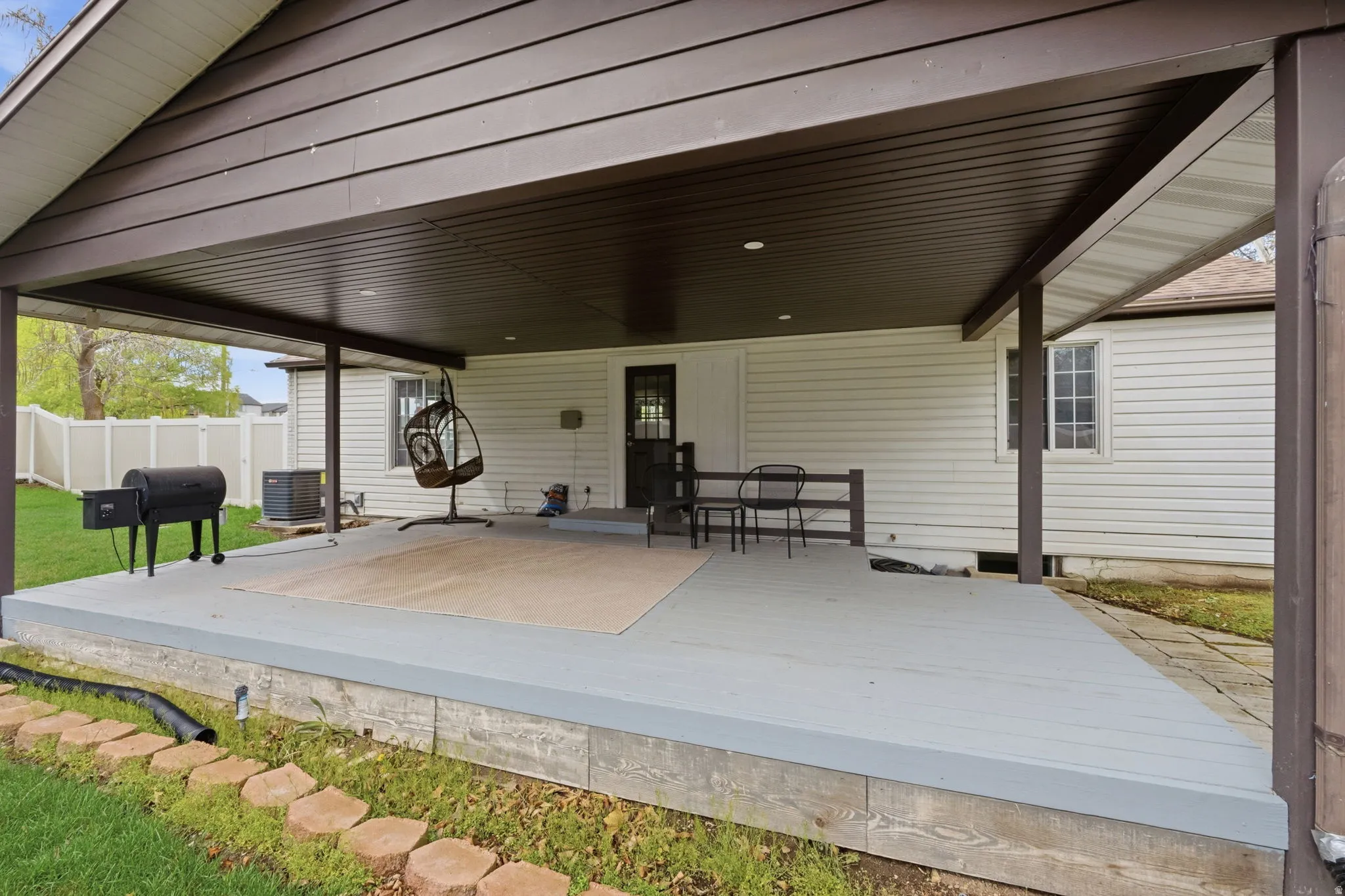 View of patio / terrace with grilling area and a wooden deck