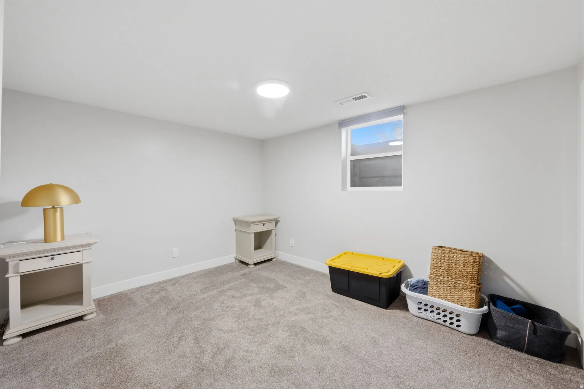 Game room featuring carpet and baseboards