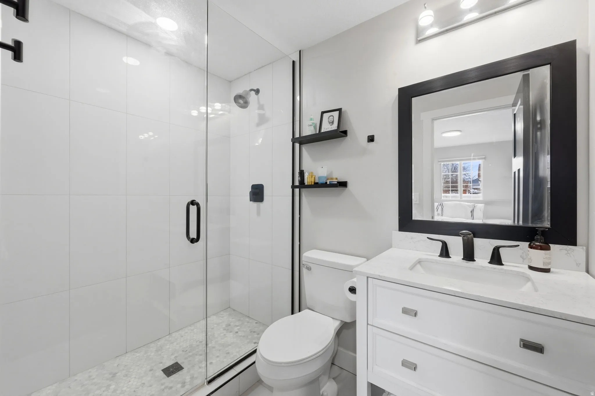 Full bath featuring vanity and a stall shower