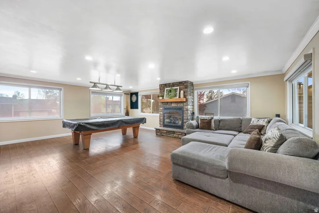 Another shot of the PREMO Rec room with plenty of natural light, gas fireplace, and billiards table