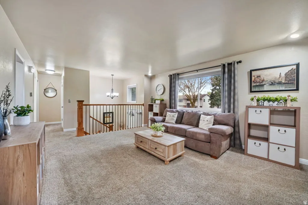 Split Entry works for this home, Living area featuring HUGE window, lighter carpet.