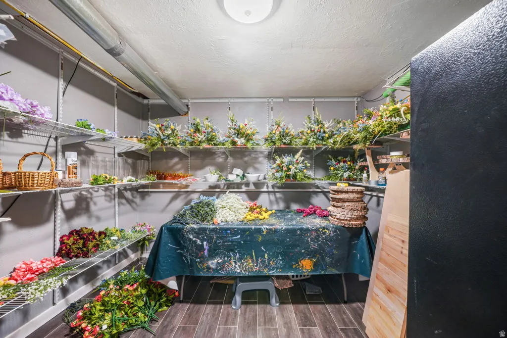 Walk-in utility room just off the laundry with a floral workspace or your workspace, preparing for 2 weddings in the backyard in June.