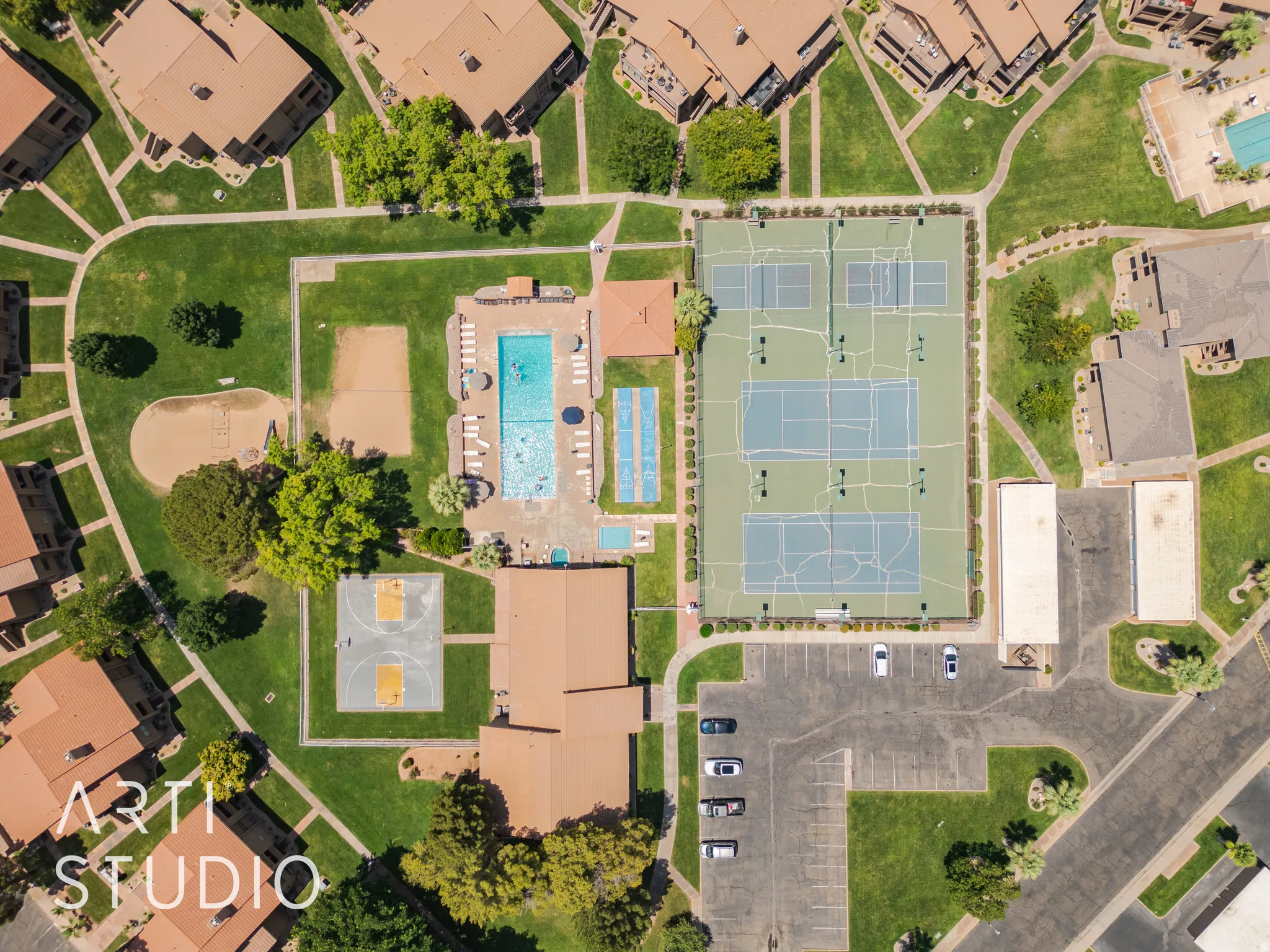 Aerial perspective of suburban area featuring a pool area