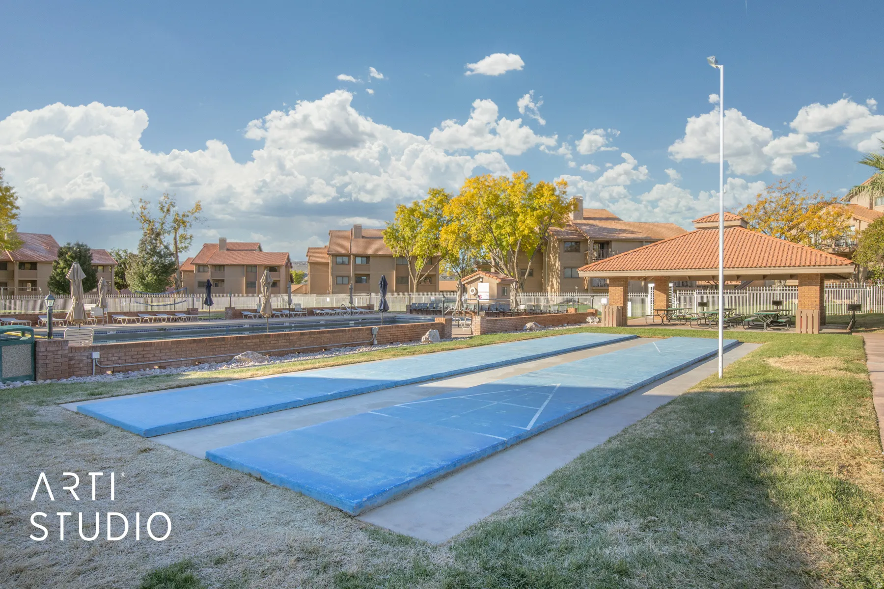 Surrounding community with shuffleboard and a residential view