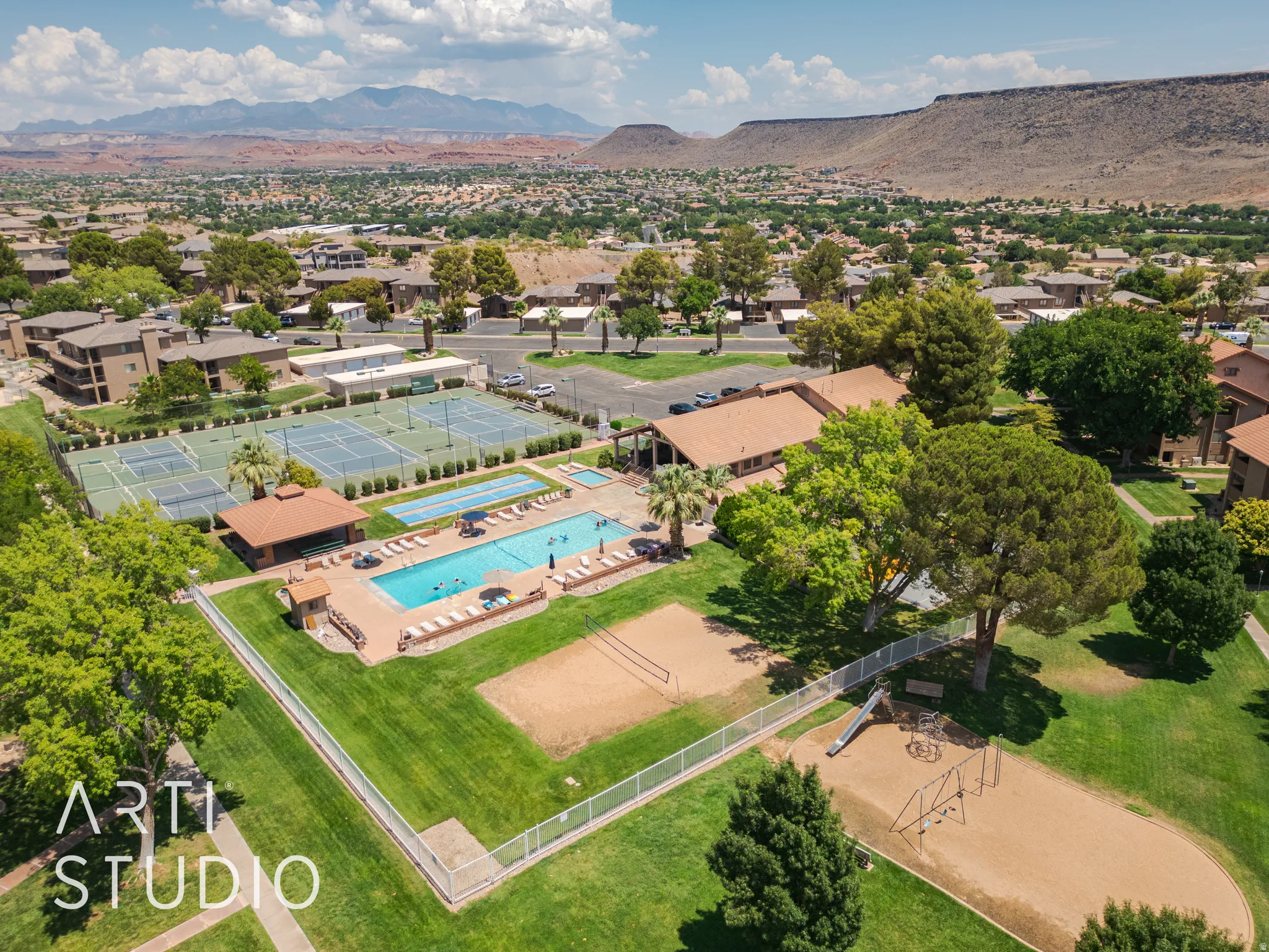 Drone / aerial view of a pool and a mountainous background