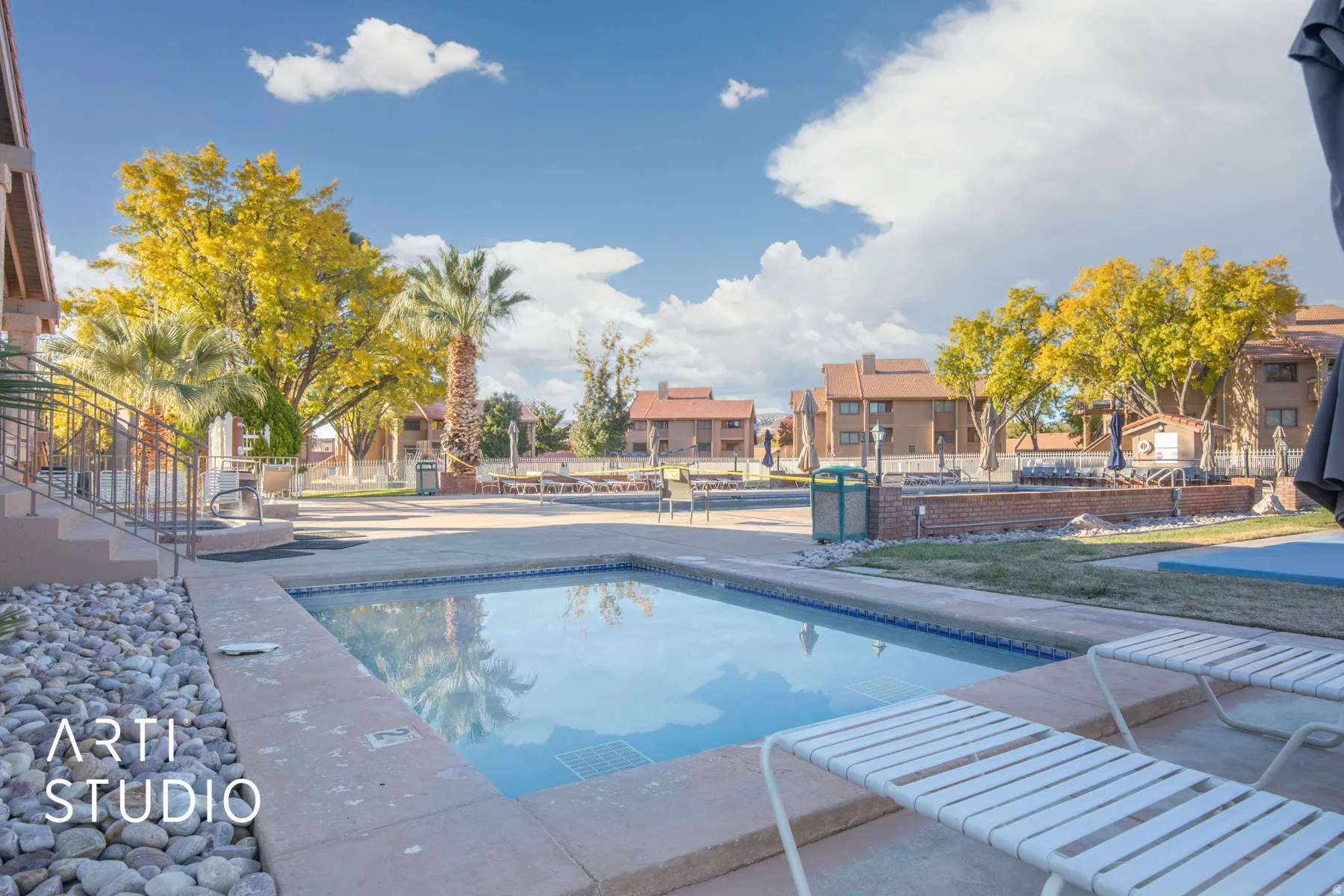 Community pool featuring a residential view and a patio
