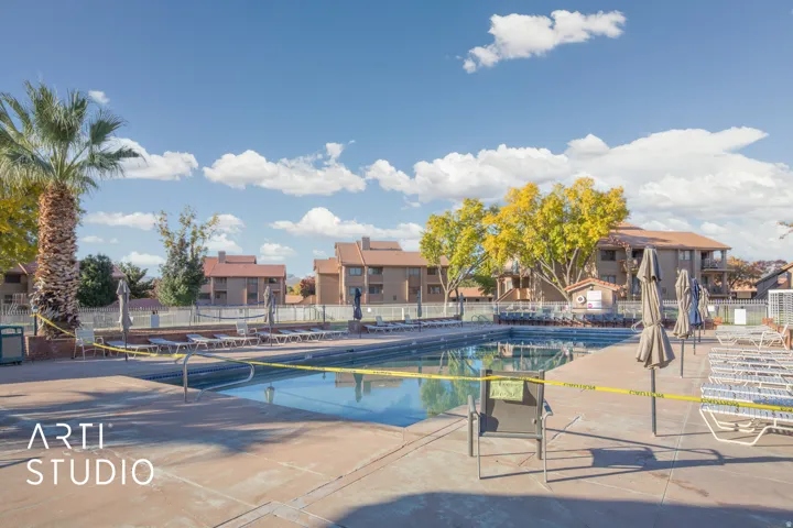 View of pool with patio surround and a residential view