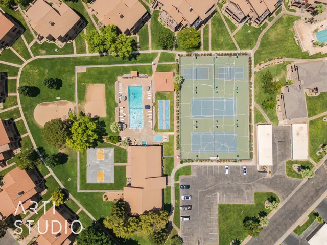 Aerial perspective of suburban area featuring a pool area