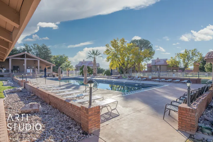 Community pool with a patio