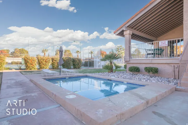 Community pool featuring a patio