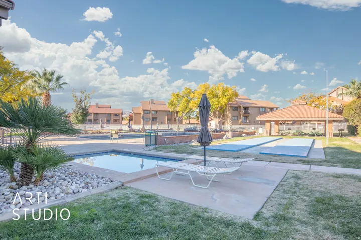 View of swimming pool with patio surround, a residential view, and a gazebo