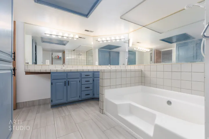 Full bath with vanity, a bath, and tiled shower