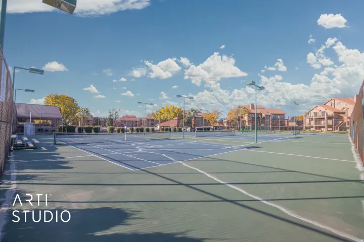 View of tennis court featuring a residential view