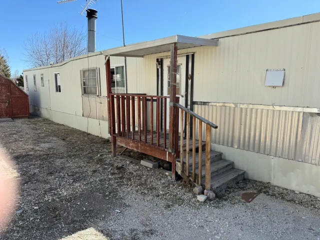 Entry deck with wood railing and steps